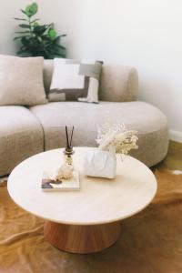 a coffee table in a living room with a couch at Hampton Luxe Designer Retreat with Park Views in Melbourne +38 photos