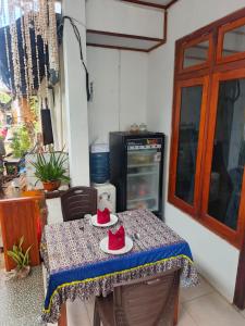 a table with red shoes on top of it at Heiner Beach Homestay in Bunaken +17 photos