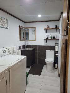 a bathroom with a sink and a toilet at Stephna555 in Saint-Pascal +28 photos