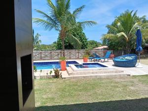 a view of the pool from the house at Sítio Moriá in Camaçari