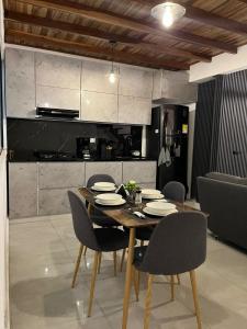 a dining room table and chairs in a kitchen at Apto Domus in Pamplona
