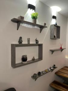 a room with shelves on the wall with shoes at Apto Domus in Pamplona +7 photos