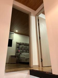 a view of a living room with a couch through a doorway at Apto Domus in Pamplona