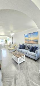 a living room with a couch and a table at Beach Condo in Clearwater Beach
