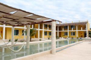 a view of the hotel from the pool at Villas Coral in Dzidzantún +14 photos