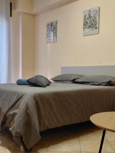 a bed with two pillows on it in a room at La Terrazza Apartment in Cosenza