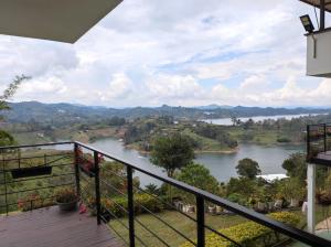 a view of a river from the balcony of a house at Finca Villa Lake in Horizonte