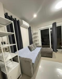 a bedroom with a bunk bed and a couch at Tyne Haven in San Juan