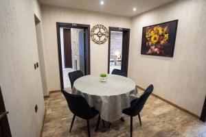 a dining room with a round table and chairs at Къща за гости Бъчвата in Elkhovo