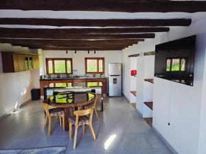 a kitchen with a table and chairs in a room at Casa Hotel La Morada in Villa de Leyva