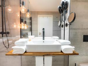 a bathroom with a sink and a shower at Hotel City Maribor in Maribor +224 photos