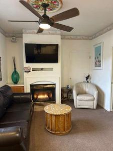 a living room with a couch and a fire place at Low Tide Lounge in Oceano