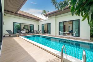 an image of a swimming pool in a villa at Rawai - 3 BR Private Pool Villa - Phoomjai Villa in Rawai Beach