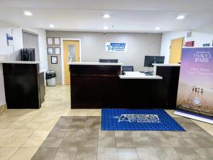 an office with a desk and a sign on the floor at Americas Best Value Inn Apache Junction in Apache Junction +21 photos