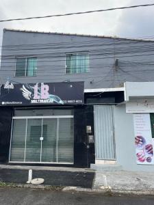 a building with a sign on the side of it at Lareaconchego in São Pedro da Aldeia