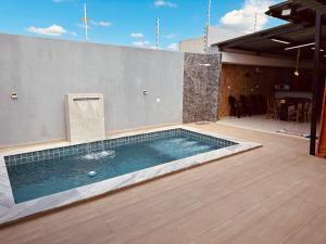 a swimming pool in the middle of a patio at CASA CONTAINER Vsa in Vitória de Santo Antão