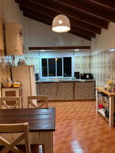 a kitchen with a table and a counter top at el maiten in Mar del Plata