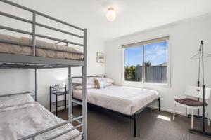 a bedroom with two bunk beds and a window at Wellington Waters in Wellington East +13 photos