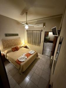 a bedroom with a large bed in a room at Hotel Ideal vcp in Villa Carlos Paz +30 photos