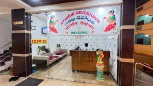 a lobby with a welcome sign and a waiting room at Bakthapriya HILL VIEW RESIDENCY in Srikalahasti