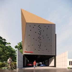 a building with a large black wall with a building at Voyager Residence in Semarang