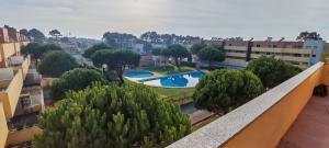 a view from the balcony of a building with a swimming pool at Furadouro pine beach apartment in Ovar