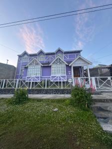 a purple house on the side of the street at Hosteria Ailen in Ushuaia