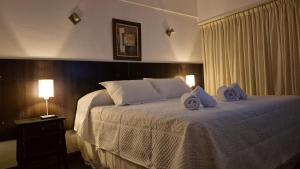 En eller flere senge i et værelse på Continental Hotel