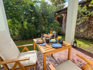 a table with food on it on a patio at City Apartments Gerlingen in Gerlingen