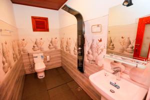 a bathroom with a toilet and a sink at Forest Edge Villa in Ella +58 photos