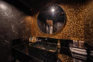 a bathroom with a mirror and a sink at HOTEL FIVE -Adult Only- in Osaka +18 photos