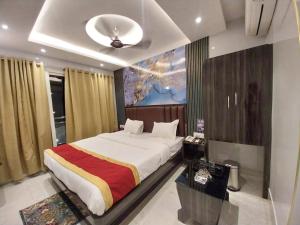 a bedroom with a large bed in a room at Hotel Sea Touch in Digha