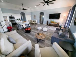 a living room with two couches and a table at The Blue House in Hitchcock