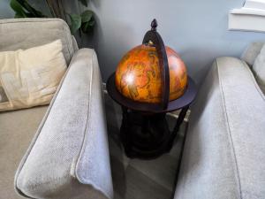 a lamp sitting on a table next to a couch at The Blue House in Hitchcock