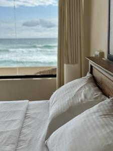 En eller flere senge i et værelse på Pelican Ahangama