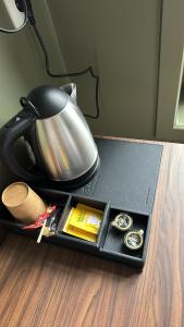 a tray with a lamp and watches on a table at Gran Hotel De Passage in Bruges
