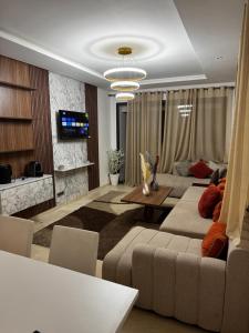 a living room with a couch and a table at Murcia in Rabat