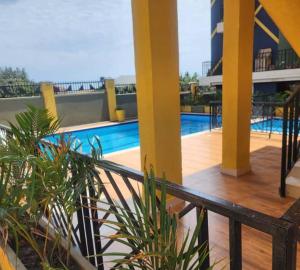 a balcony of a building with a swimming pool at Nuellas Haven in Kira
