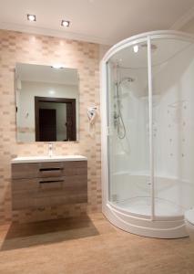 a bathroom with a shower and a sink at Hotel Noguera El Albir in Albir