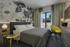 Ένα ή περισσότερα κρεβάτια σε δωμάτιο στο Residence Rovinj +27 φωτογραφίες
