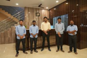 a group of men standing in a room at Hotel SagarPriya in Digha +93 photos