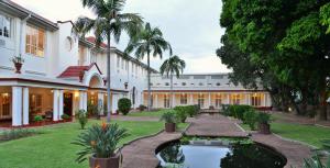 A garden outside The Victoria Falls Hotel