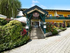 a entrance to a building with stairs and flowers at Krumbacherhof in Krumbach Markt