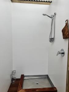 a bathroom with a glass shower in a white wall at Harbourview Hideaway in Riverton +8 photos