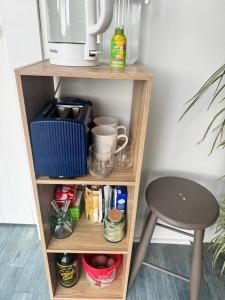 a shelf with a coffee maker and a stool at Harbourview Hideaway in Riverton