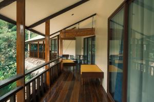 a view of the balcony of a house at Easy Does It Guesthouse Siargao in General Luna