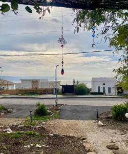 an empty parking lot with a street with a street light at Boho B&B in Amnon