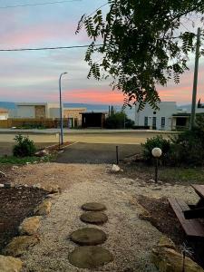 a walkway with rocks on the side of a street at Boho B&B in Amnon