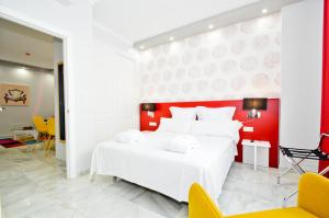 Ein Bett oder Betten in einem Zimmer der Unterkunft The Zentral Arenal Suites