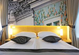 Letto o letti in una camera di Hotel Grad